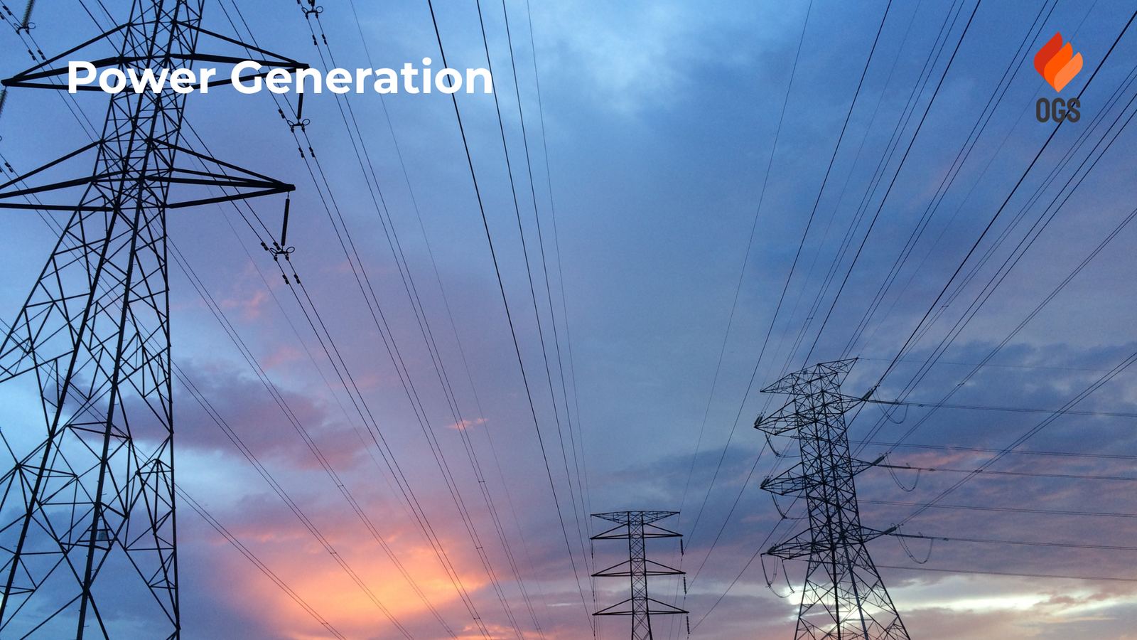 High-voltage transmission towers at sunset